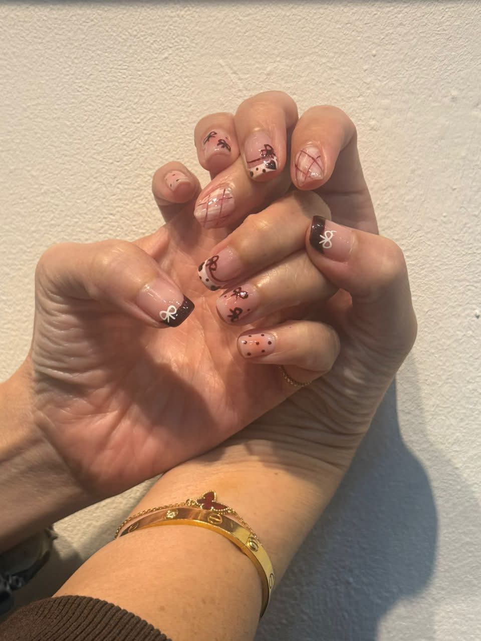 Black French tips with bows and leopard accents